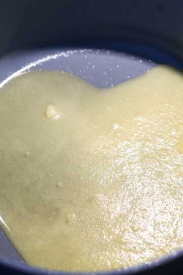 Ghee melting in a pan.