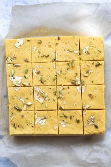Burfi cut into 16 pieces.