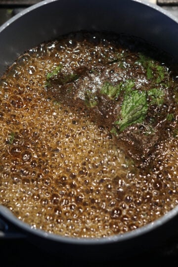 Mint tea simmering in a pot.
