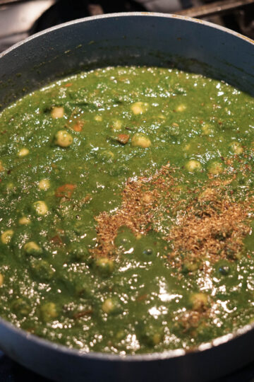 Garam masala sprinkled on chana palak.