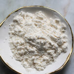 Custard powder in a small dish.