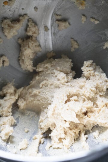 Butter and sugar creamed in a bowl.