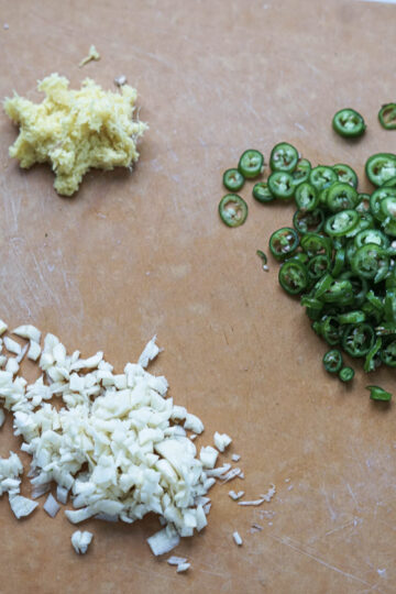Chopped green chili, garlic, and crushed ginger root.