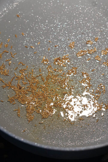 Cumin seeds in oil.