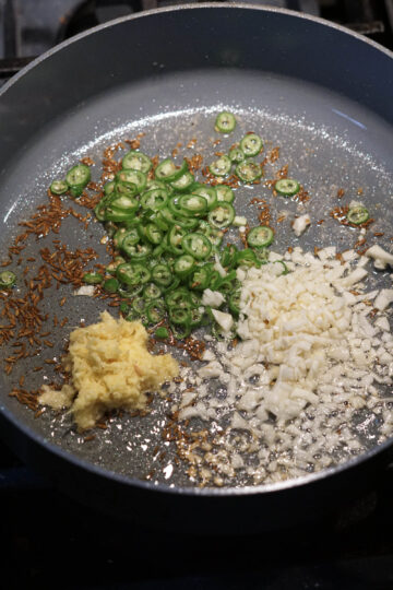 Green chilies, ginger root crushed, and chopped garlic.