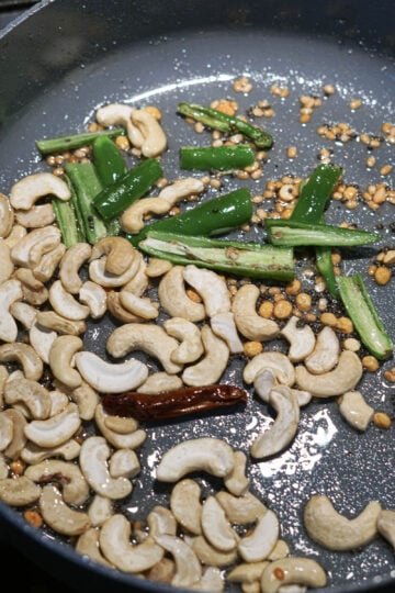 Cashews added to pan.