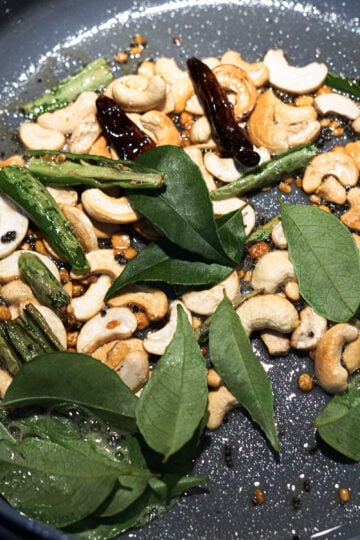 Fresh curry leaves in tadka.