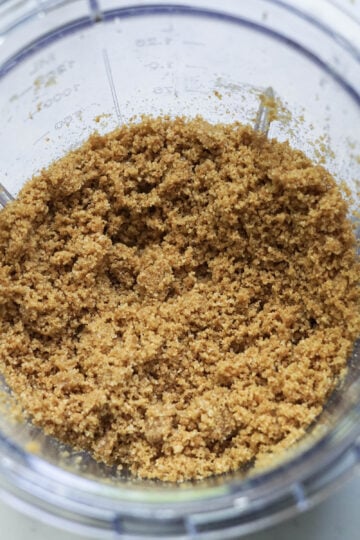 Graham cracker crumble in a food processor jar.