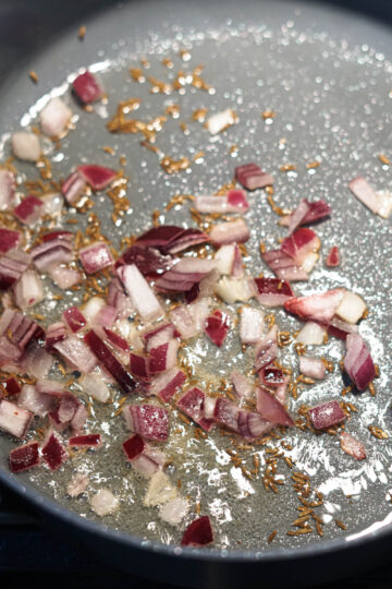 Chopped onions added to pan.