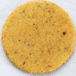 Baked badam puri on a plate.