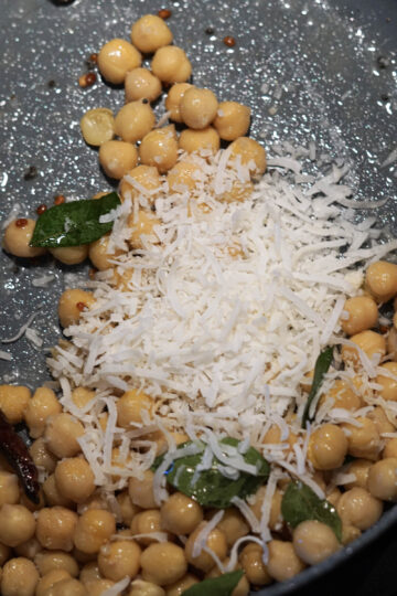 Shredded coconut and salt added to pan.