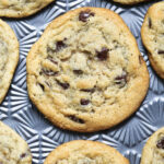 Eggless chocolate chip cookies on a baking sheet.