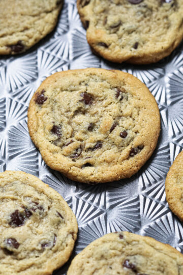 Baked eggless cookies on a cookie sheet.