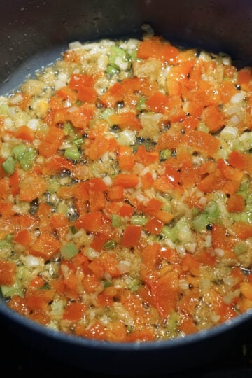 Red peppers added to pan.
