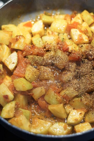 Garam masala and sugar added to pan.