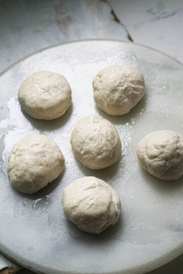 Six paratha dough balls.