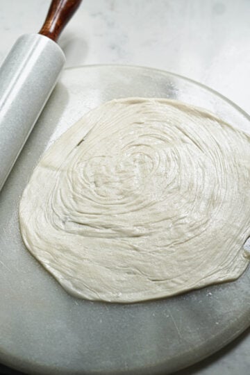 Rolled out malabar paratha with layers.
