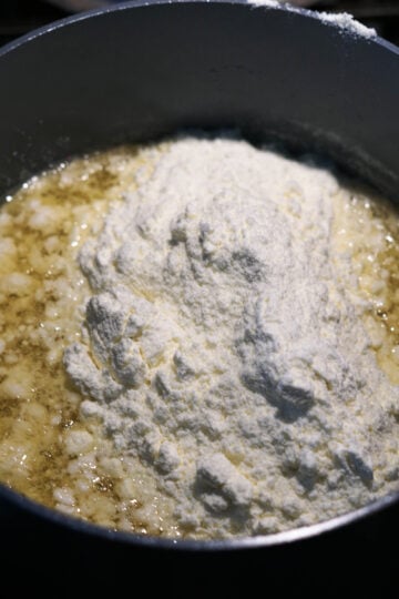 Milk powder added to pot.