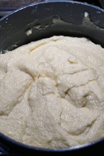 Thick fluffy burfi mixture.