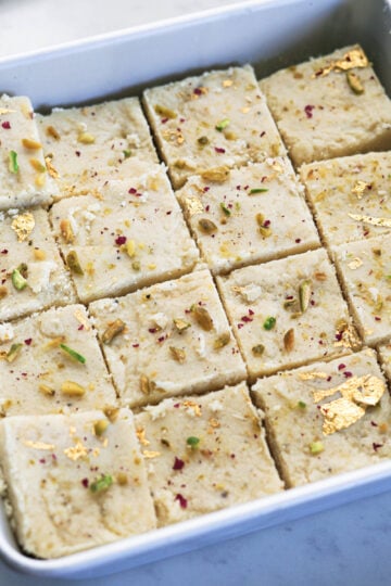 Tray filled with milk powder burfi.