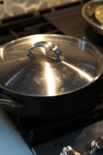 Covered pot on the stove.