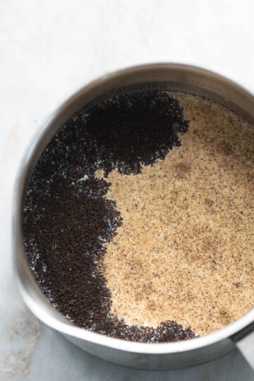 Water, milk, tea leaves, chai masala, and sugar in a pot.