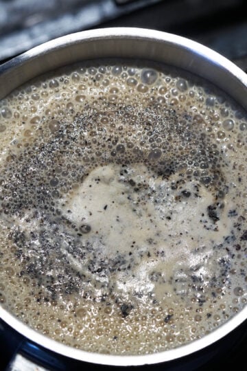 Foaming chai boiling to top of pot.
