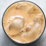 Top view of a glass of iced chai.