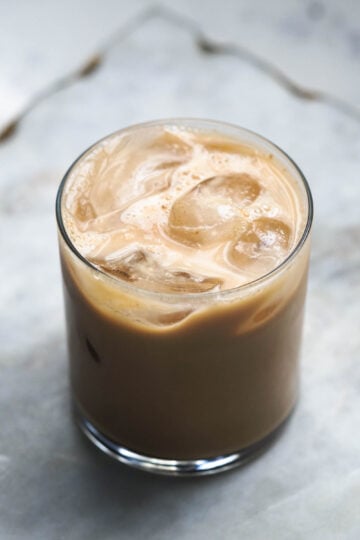 Glass of iced chai tea latte.