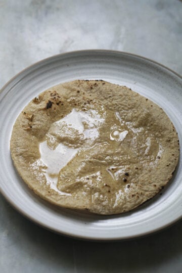 Ghee spread on a sorghum roti.