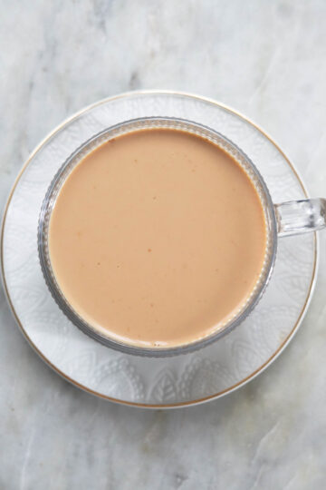 Pumpkin chai latte in a mug, top down view.