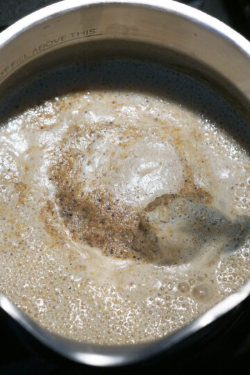 Foaming chai in a pot.