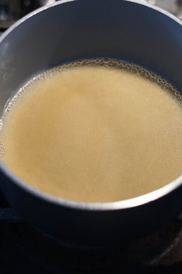 Sugar and water in a pot.