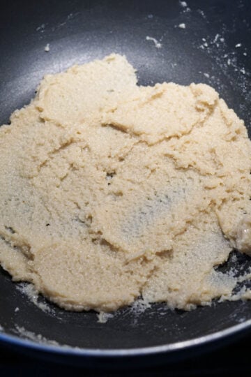 Almond modak mixture in a pan.