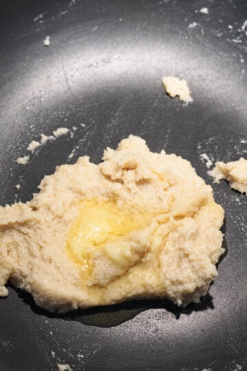 Ghee added to modak mixture.