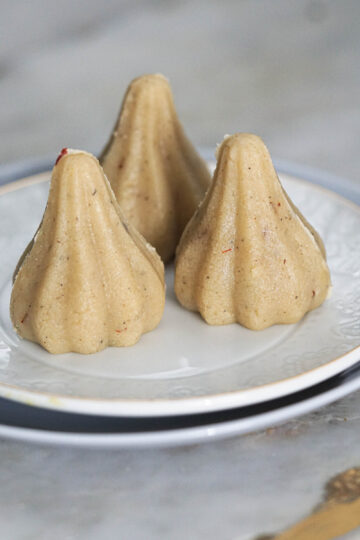 Almond modaks on a plate.