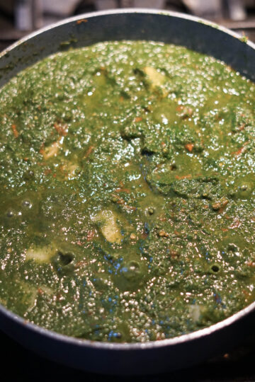Garam masala mixed into saag aloo.