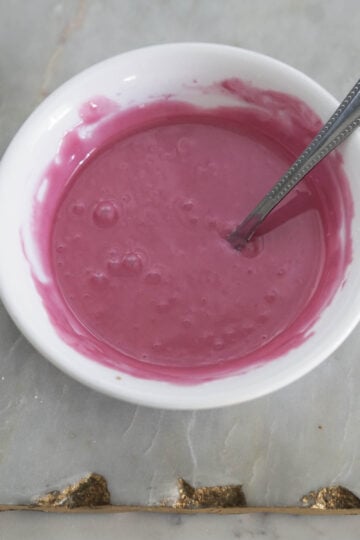 Rose icing in a bowl.
