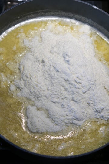 Milk powder added to burfi mixture.