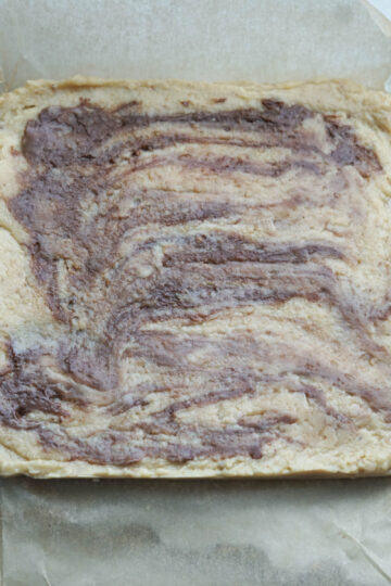 Ferrero rocher burfi in a pan.