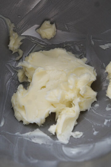 Butter in a mixing bowl.