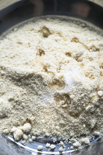 Almond flour, salt, and oil in a pot.