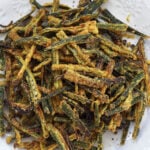 Kurkuri bhindi, Indian okra fries, in a white plate.