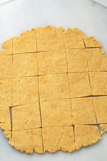 Cut dhokli dough into squares.
