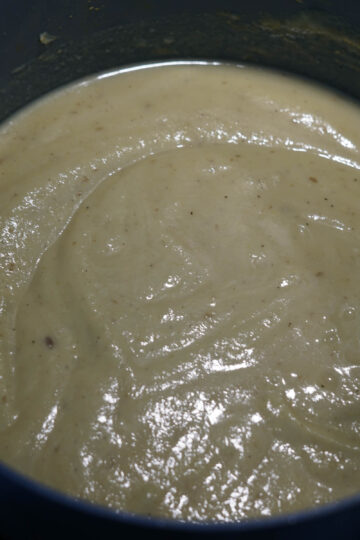 Creamy curried Indian cauliflower soup in a pot.
