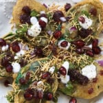 Crispy palak chaat made with spinach leaf bhaji and topped with chaat toppings.