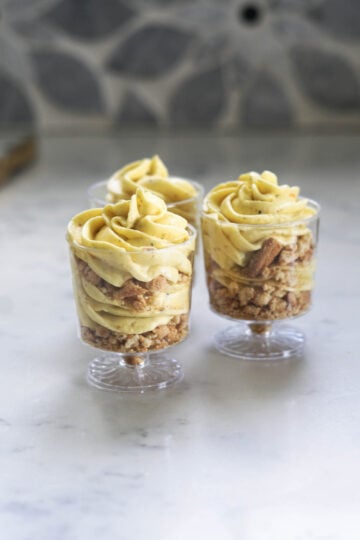 Thandai mousse cups in serving glasses.